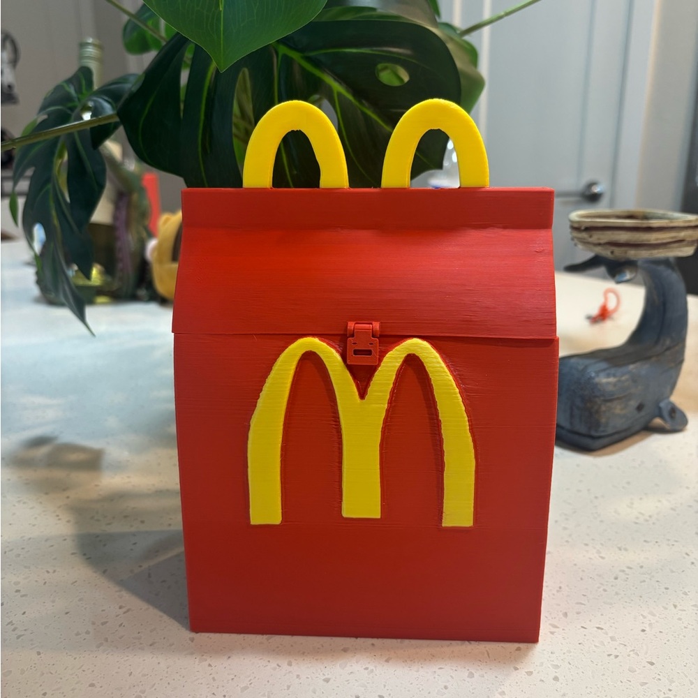 Red Box with Yellow M Design